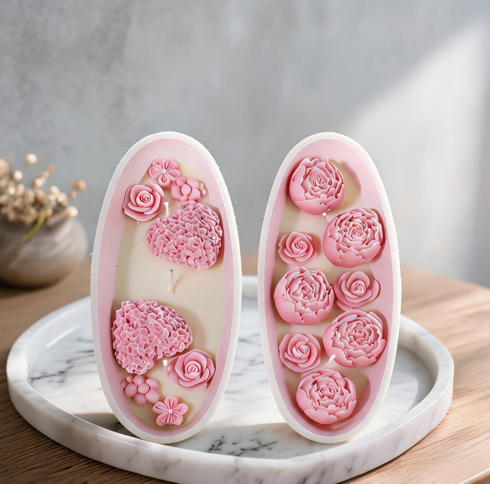 Heart Shape and Peony Bloom rose candle sets standing upright on marble tray